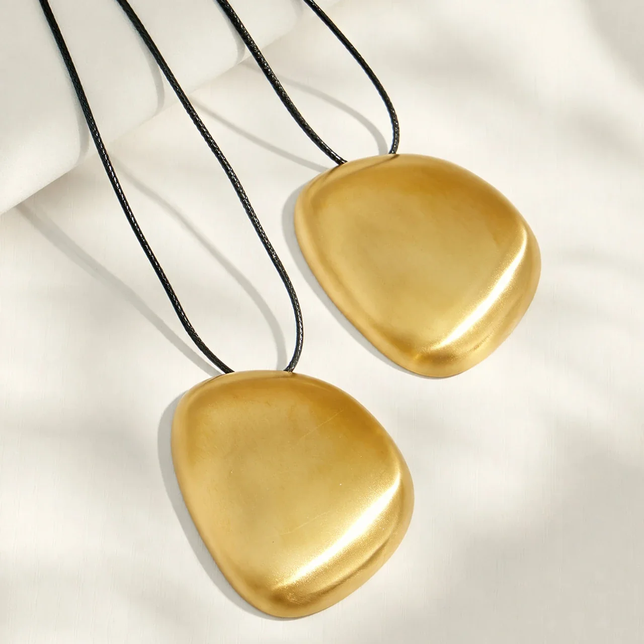 Sculptural Stainless Steel Pebble Cord Pendant Necklace