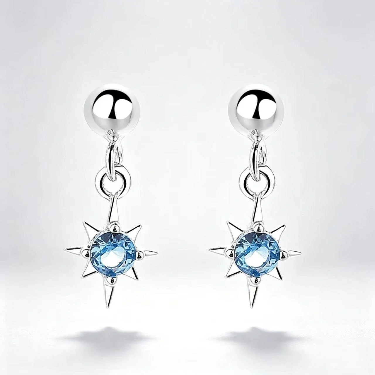 Celestial 925 Sterling Silver Blue CZ Eight-Point Star Drop Earrings