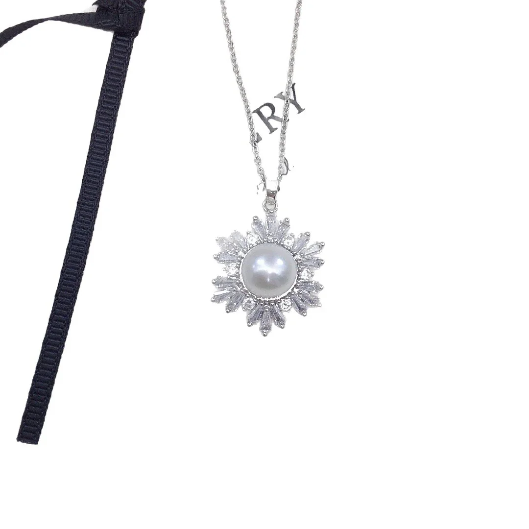 Radiant Gold-Plated Snowflake Baguette Pearl Pendant Necklace