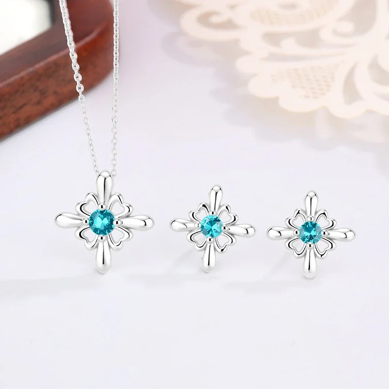 Ornate Silver-Plated Copper Open Flower Teal Crystal Stud Earrings
