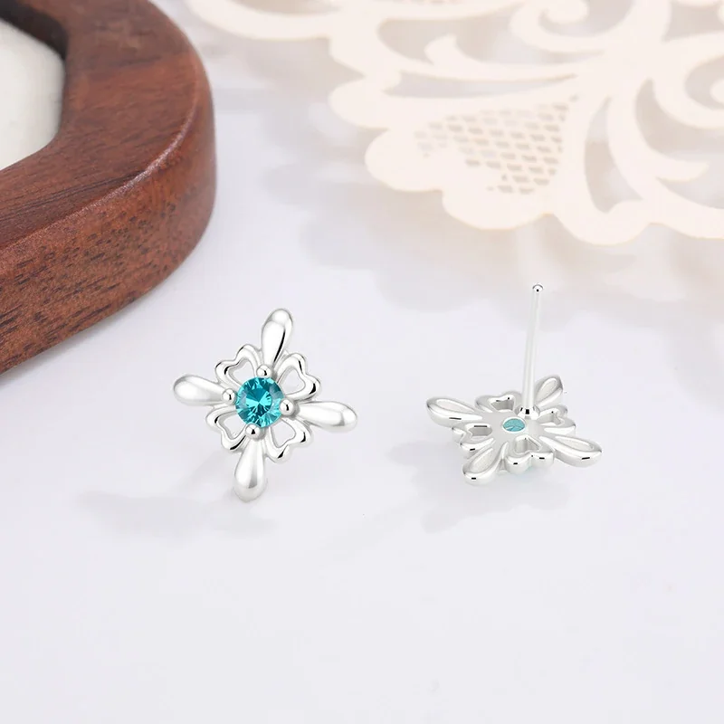 Ornate Silver-Plated Copper Open Flower Teal Crystal Stud Earrings