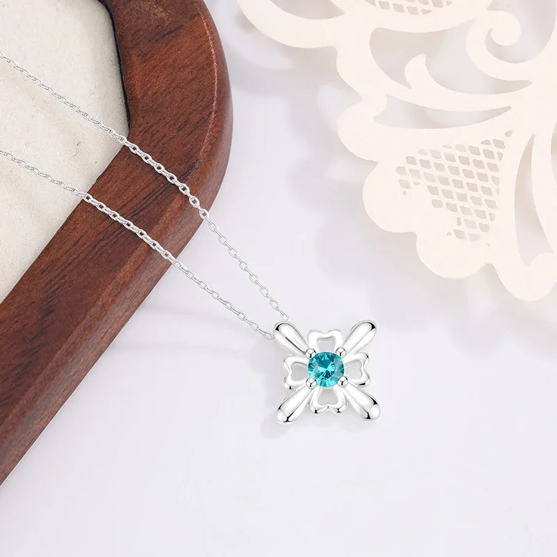 Ornate Silver-Plated Copper Open Flower Teal Crystal Stud Earrings