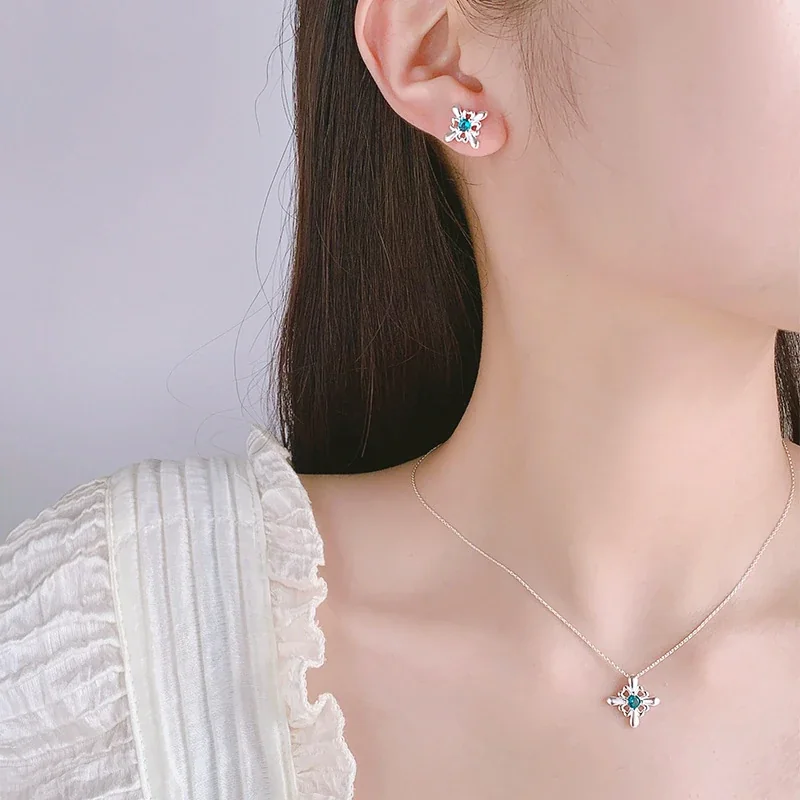 Ornate Silver-Plated Copper Open Flower Teal Crystal Stud Earrings