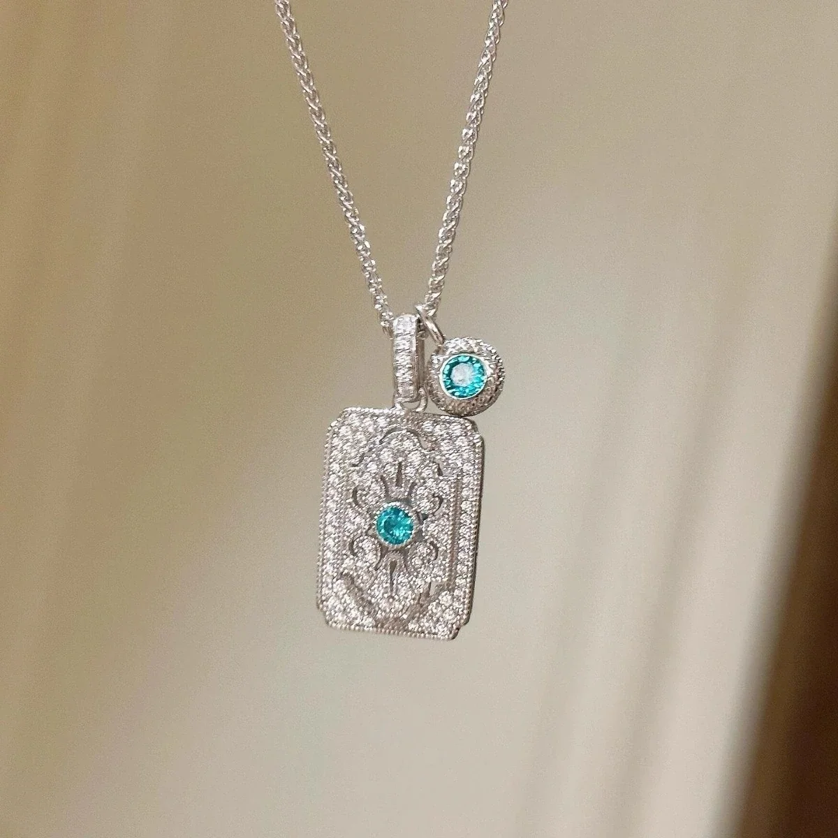 Ornate Silver-Plated Copper Lace Plaque Blue Crystal Necklace