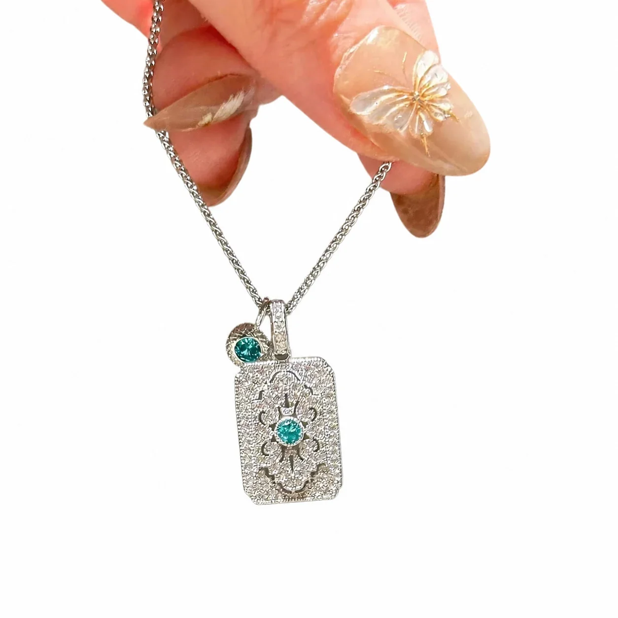 Ornate Silver-Plated Copper Lace Plaque Blue Crystal Necklace