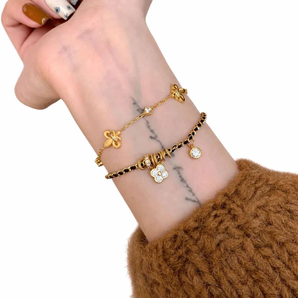 Ornate Gold-Plated Black Woven Clover CZ Copper Bracelet
