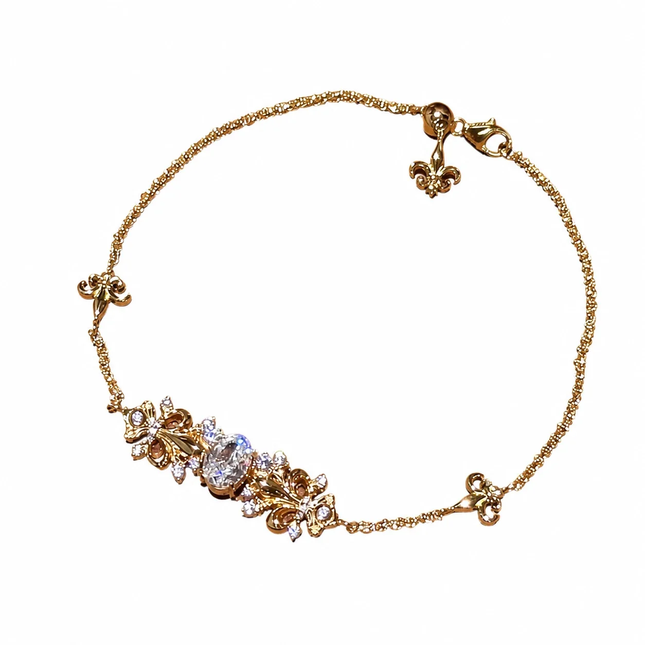 Ornate Gold-Plated Iris Motif Round Cubic Zirconia Copper Bracelet