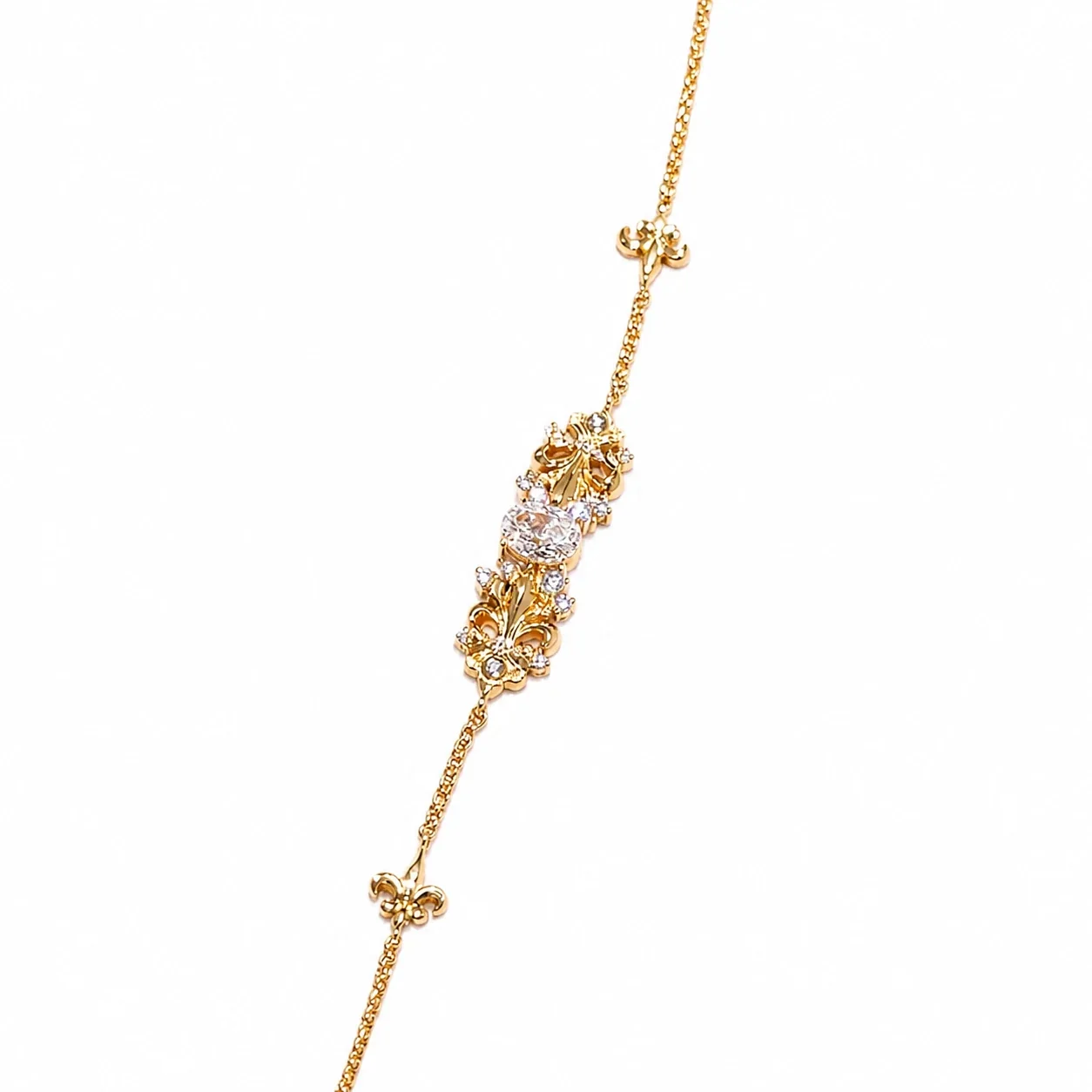 Ornate Gold-Plated Iris Motif Round Cubic Zirconia Copper Bracelet