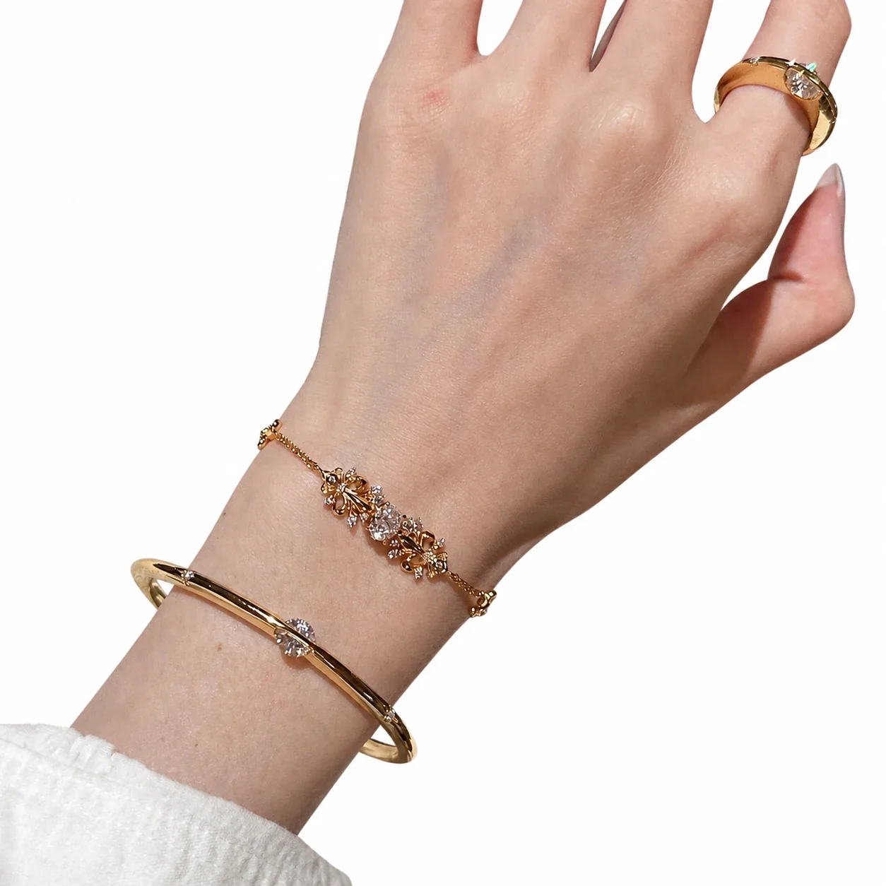 Ornate Gold-Plated Iris Motif Round Cubic Zirconia Copper Bracelet