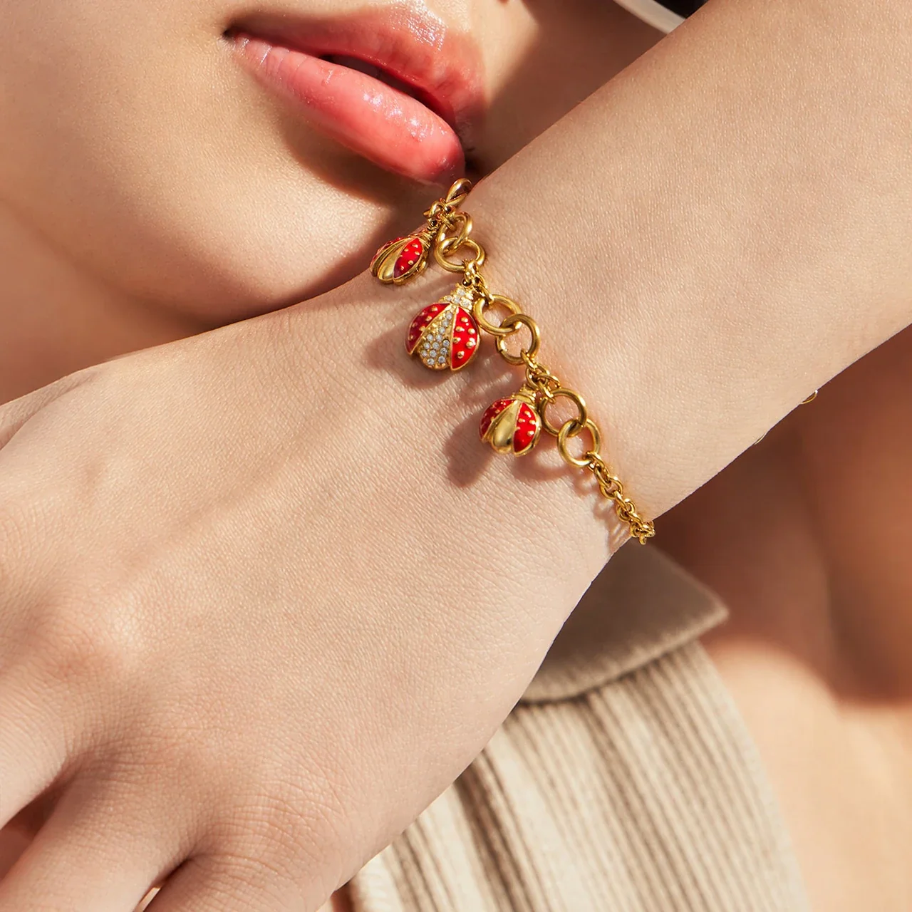 Playful Red Enamel Ladybug Charm Stainless Steel Bracelet