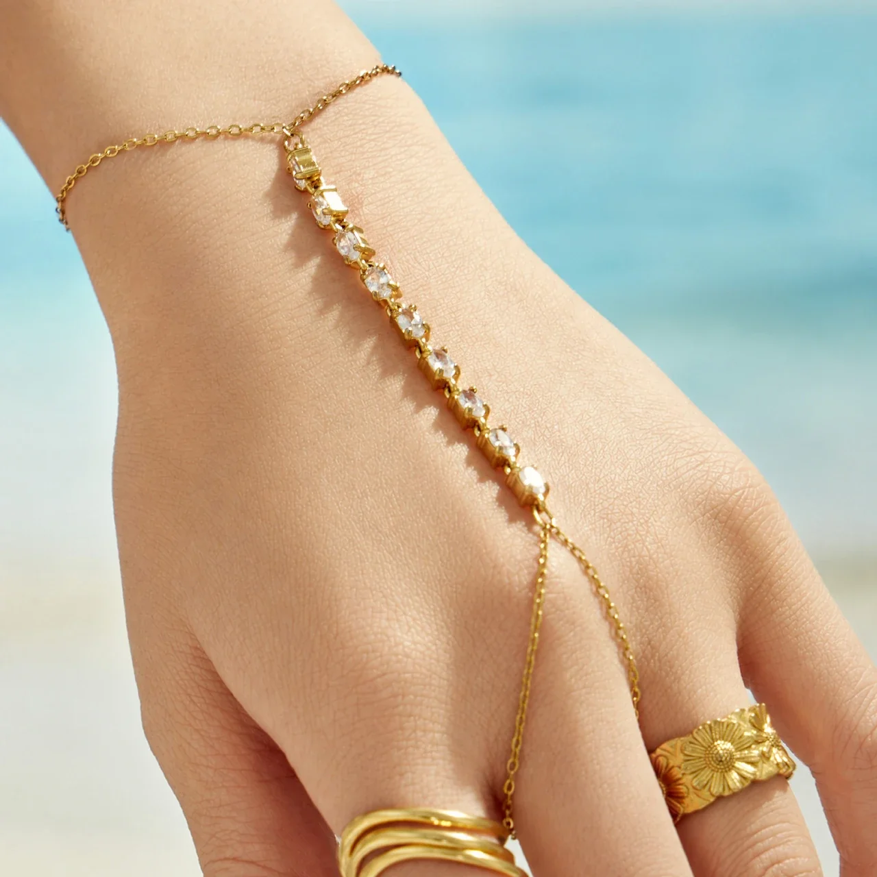 Sleek Gold-Plated CZ Wave Finger Chain Bracelet